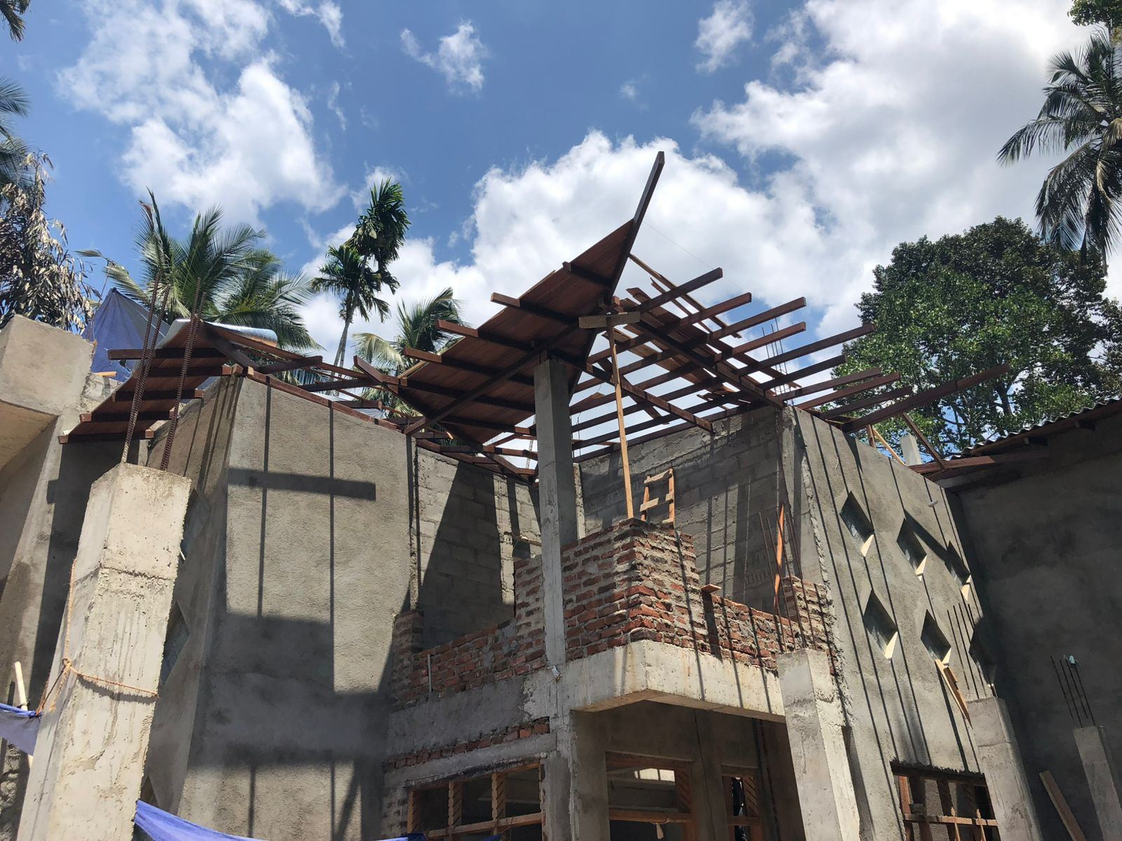Brick pillars supporting a fresh timber roof structure